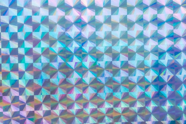 Foto fondo de holograma abstracto de textura iridiscente de hoja de arco iris holográfica