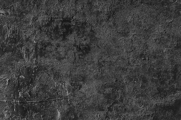 Fondo de hormigón agrietado de pared vieja negra / textura negra abstracta, fondo antiguo vintage