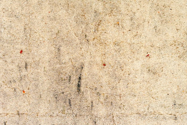 Fondo de hormigón de textura de pared. Fragmento de pared con arañazos y grietas.