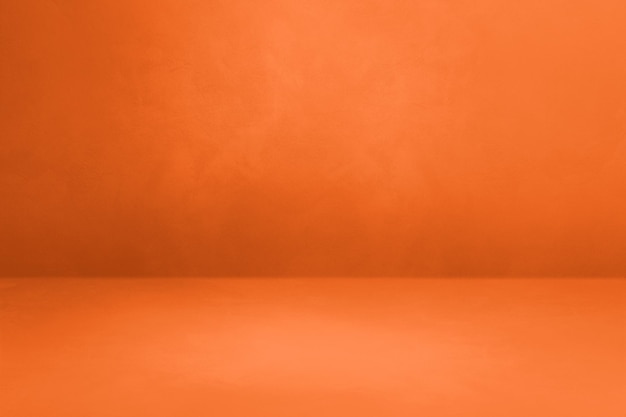 Fondo interior de hormigón naranja de neón vacío