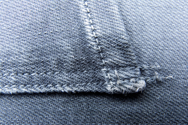 Fondo de jeans denim / Fondo de jeans con costura de diseño de moda de jeans / Textura de jeans con costuras.