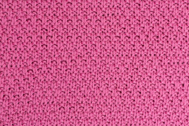 Fondo de lana perla de tejido de punto rosa La estructura del tejido con una textura natural Fondo de tela Fondo de lana de punto