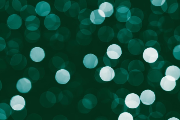 Fondo de luces bokeh de navidad verde esmeralda turquesa abstracto