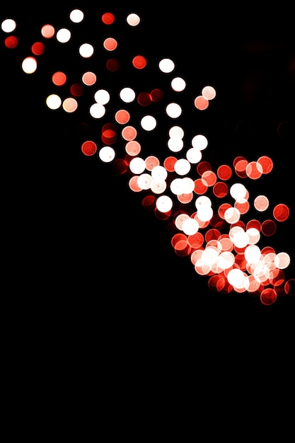 Fondo de luces brillantes multicolores abstractos borrosos sobre fondo negro