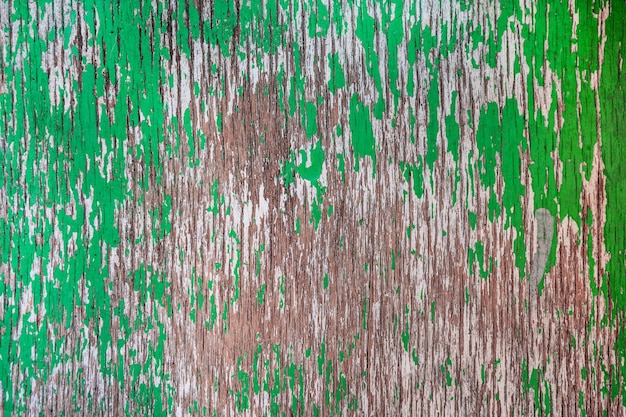 Fondo de madera madera desgastada pintada con pintura verde