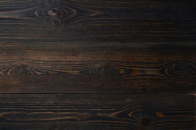 Fondo de madera oscura con madera de pino, estructura de madera con nudos.