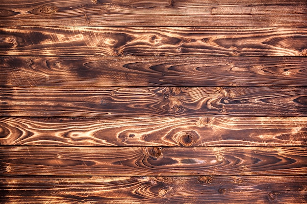 Fondo de madera oscuro, textura de madera rústica.