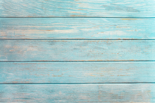 Fondo de madera de la playa del vintage - tablón de madera resistido viejo pintado en color turquesa o azul del mar.