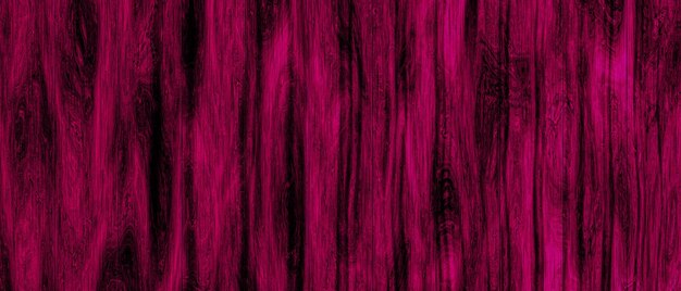 Fondo de madera con textura abstracta y color rosa.