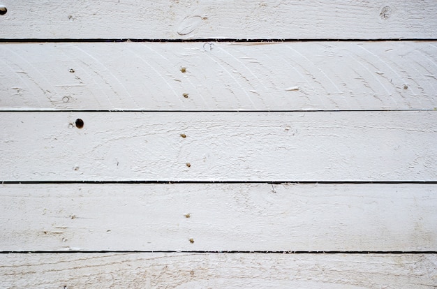 Fondo de madera vieja textura blanca. Primer plano de tablas horizontales.