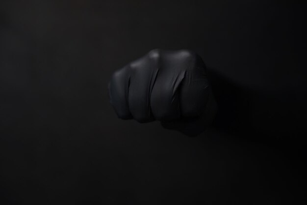 Fondo de manos en guantes Guantes negros Gestos con las manos en guantes negros