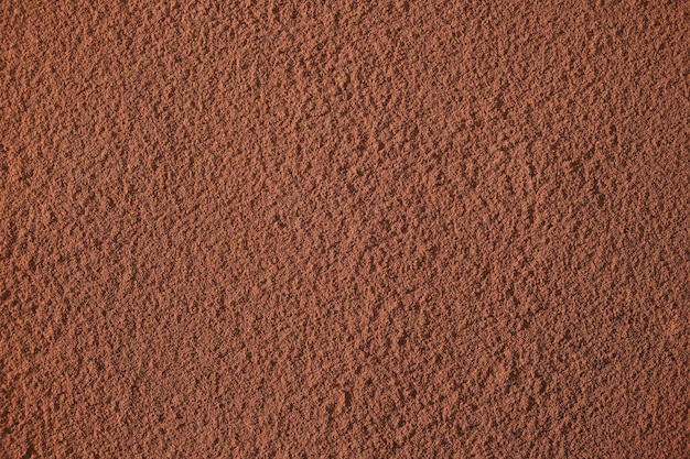 Fondo marrón abstracto, cacao en polvo, ingrediente de confitería.