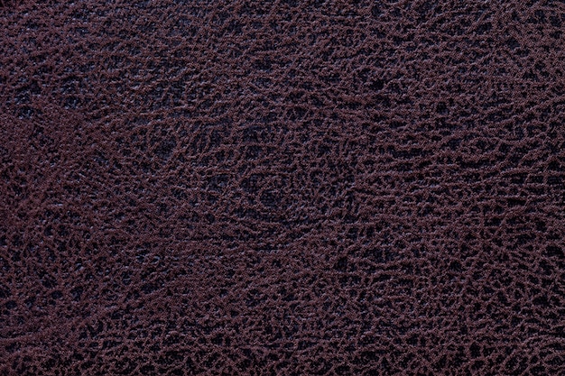 Fondo marrón de un material textil de tapicería suave, primer plano.