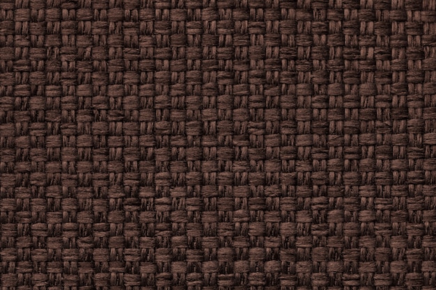 Fondo marrón con el patrón a cuadros, primer plano. Estructura de la macro de la tela.