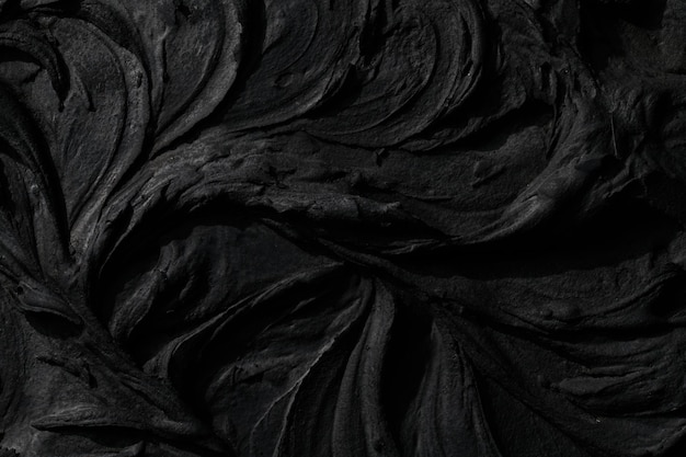 Fondo de masilla negra decorativa Textura de pared con pasta de relleno aplicada con espátula guiones caóticos y trazos sobre yeso Diseño creativo piedra patrón cemento