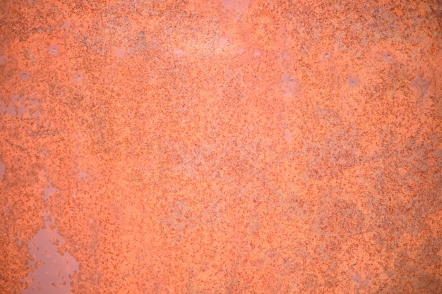 Fondo de metal oxidado y dañado. Viejo fondo textured del metal anaranjado.