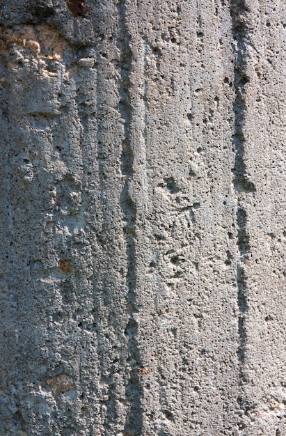 Foto fondo de muro de hormigón antiguo gris con astillas y golpes