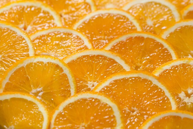 Fondo naranja brillante de rodajas de jugosa naranja. Comida sana, fondo.