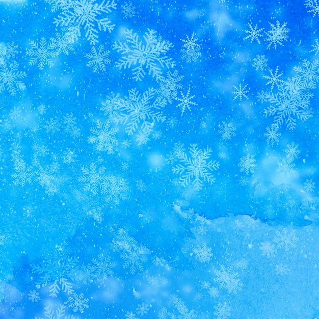 Fondo de Navidad con copos de nieve blancos