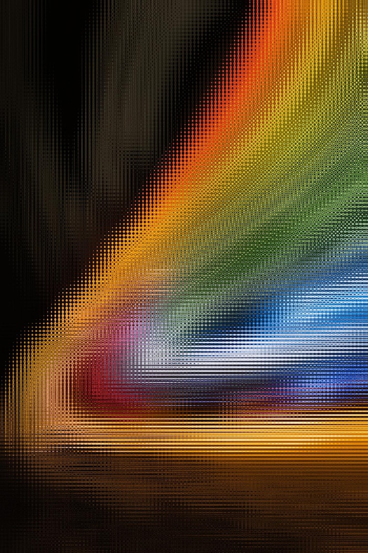 Foto un fondo negro con una luz de color arcoíris.