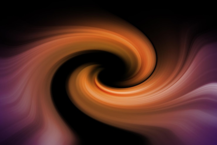 Foto un fondo negro con un remolino de colores naranja y marrón.