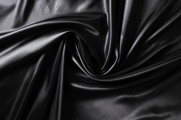 Fondo negro tejido de seda retorcido textura abstracta tela satinada