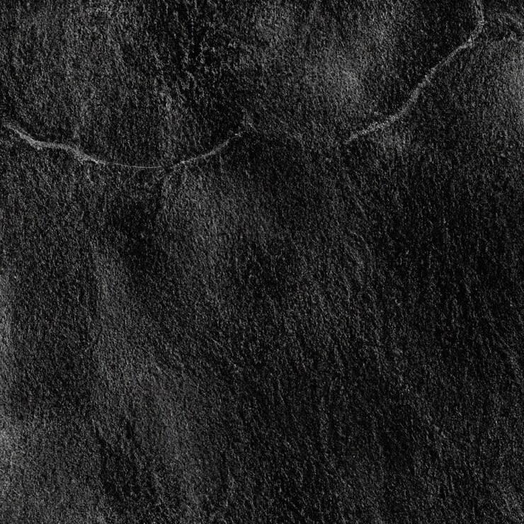 Un fondo negro con una textura rugosa que está hecho de cuero negro.