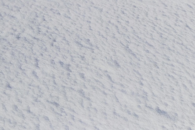 Foto fondo de nieve una superficie de nieve irregular congelada