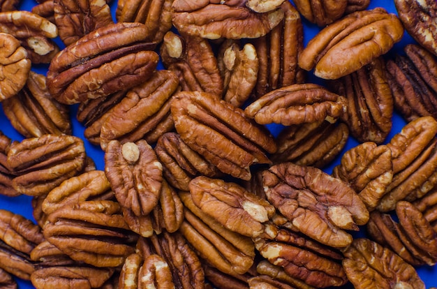 Fondo de nueces de Pekan. Closeup semillas de pekan. Vista superior