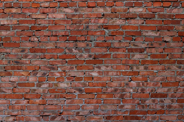 Foto fondo o textura de una pared de ladrillo rojo