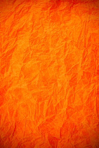 Fondo obsoleto con textura de papel naranja vintage arrugado.