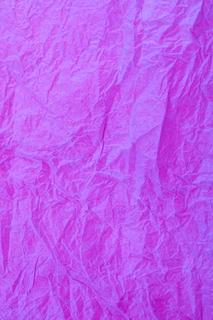 Fondo obsoleto con textura de papel púrpura vintage arrugado.