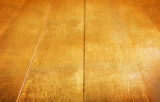 Fondo de oro textura de mesa rústica pintada de madera dorada