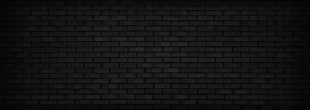 Fondo panorámico de pared de ladrillo negro