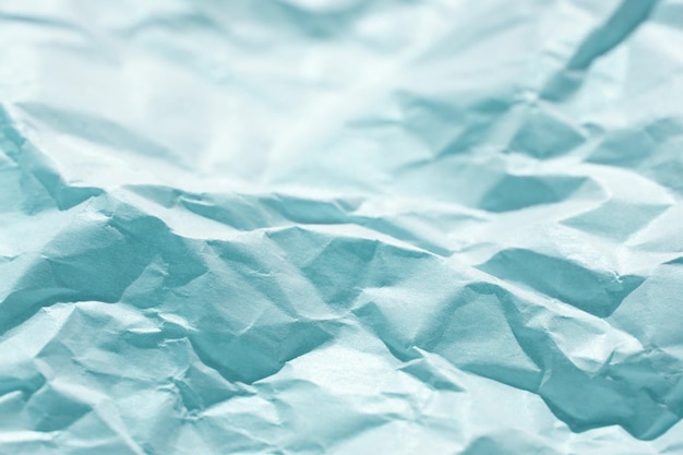 Fondo de papel arrugado grunge de color en blanco con pliegues Un enfoque selectivo de papel
