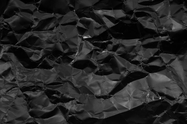 Foto fondo de papel arrugado negro fondo abstracto monocromático