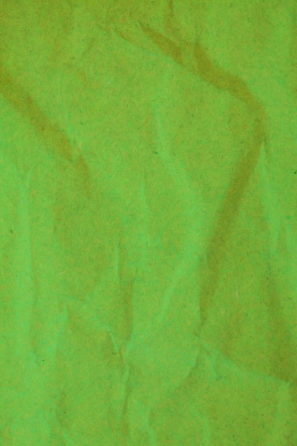 Foto fondo de papel arrugado verde.