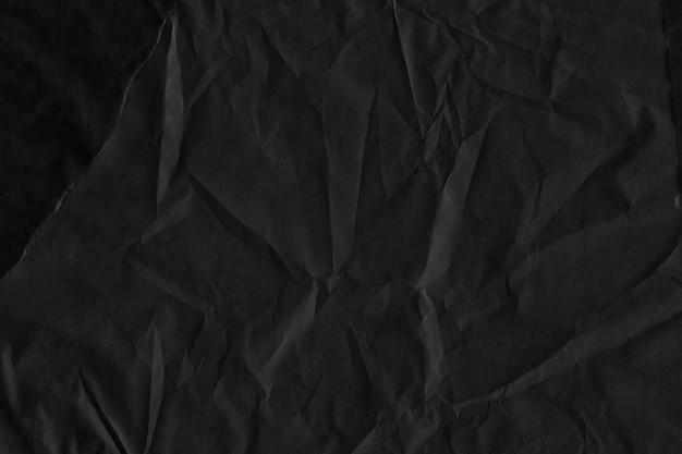 Fondo de papel arrugado vintage negro y de aspecto antiguo