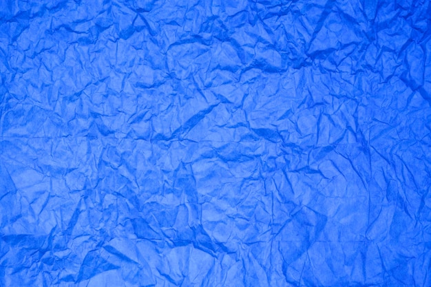 Fondo de papel azul con textura.