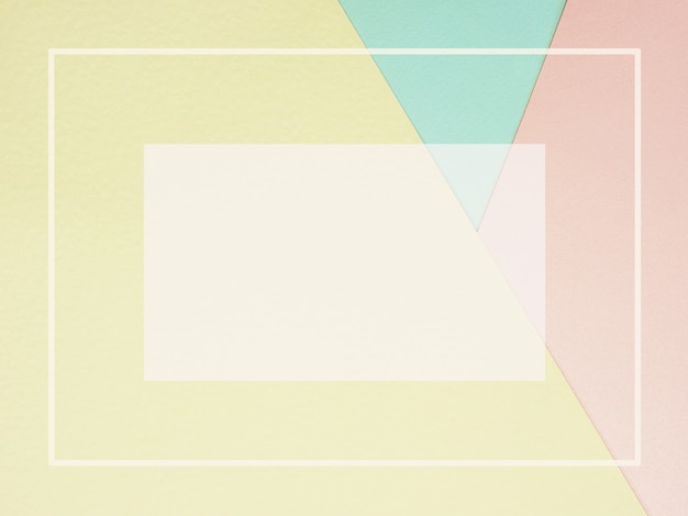 Fondo de papel de color geométrico abstracto en rosa pastel amarillo y azul con marco vacío