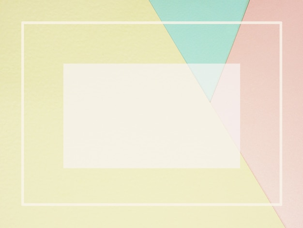 Fondo de papel de color geométrico abstracto en rosa pastel amarillo y azul con marco vacío