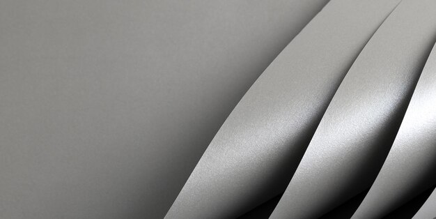 El fondo de papel de color gris brillante es liso, brillante, plateado, con textura de aluminio doblada.
