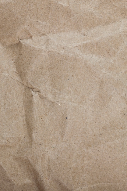 Fondo de papel marrón de embalaje arrugado con textura.
