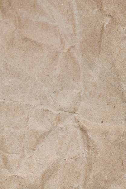 Fondo de papel marrón de embalaje arrugado con textura.