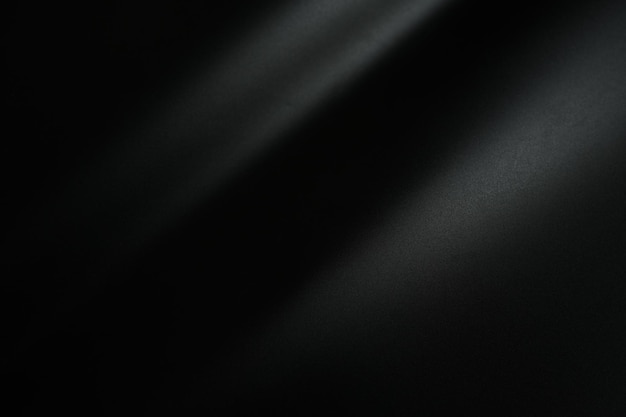 Fondo de papel negro con luz para agregar letras