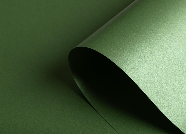 El fondo de papel verde esmeralda con una textura brillante de perlas Tonos profundos de bosque y salvia crean