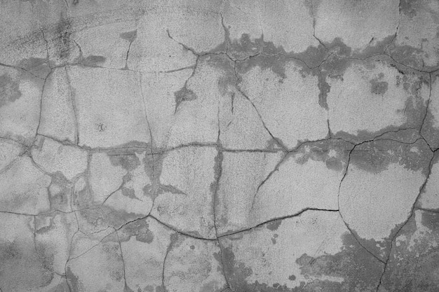 Fondo de pared agrietada en blanco y negro