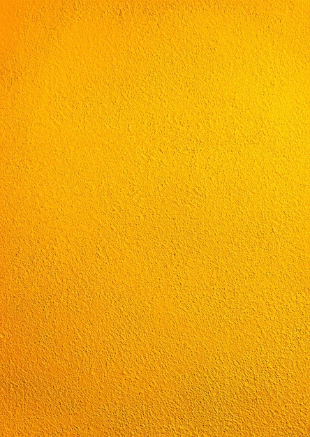 El fondo de la pared amarilla soleada