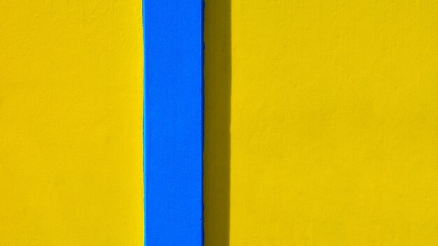 Fondo de pared amarillo y azul