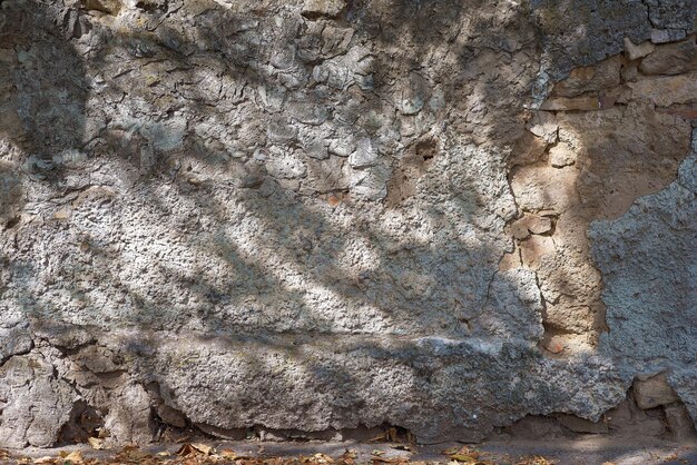 Fondo de pared de calle envejecida textura de fondo vintage piedra de mampostería antigua con cemento antiguo